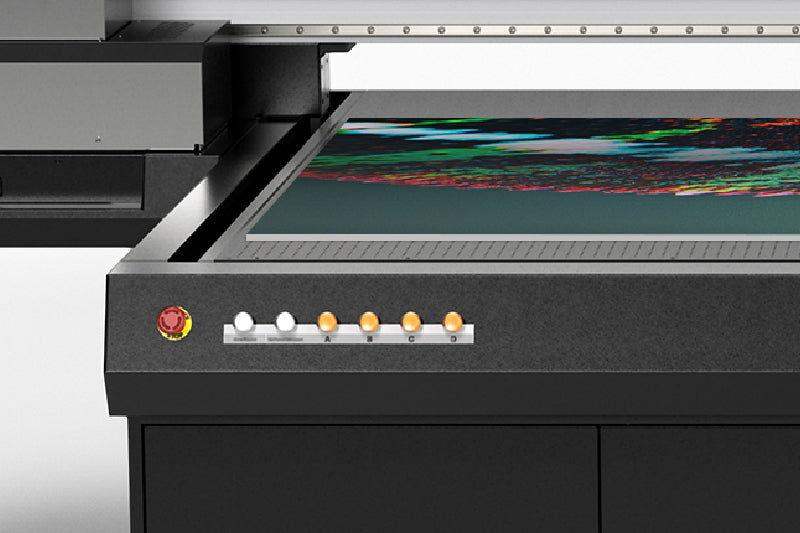 Roland EU-1000MF Flatbed UV Printer printing onto material - signmastersystems